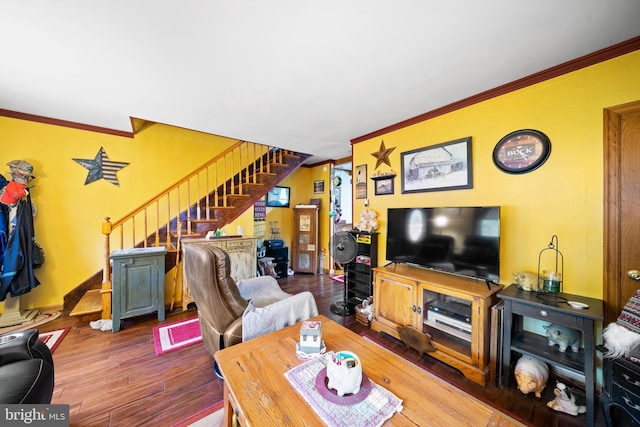 living room with hardwood / wood-style floors and ornamental molding