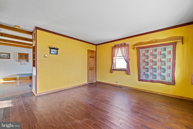 spare room with wood-type flooring and ornamental molding