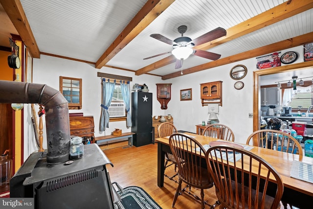 dining room with beamed ceiling, light hardwood / wood-style floors, and ceiling fan