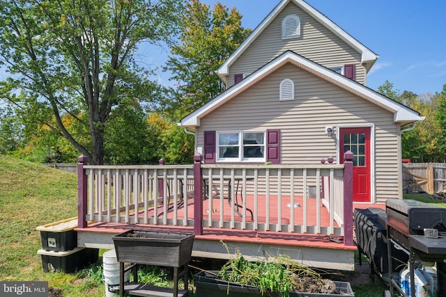 back of property with a deck