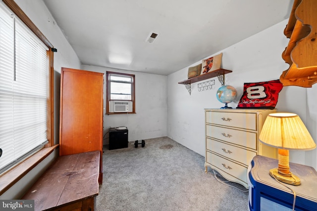 miscellaneous room featuring cooling unit and light carpet