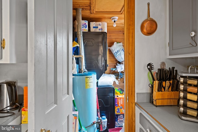 utility room featuring gas water heater