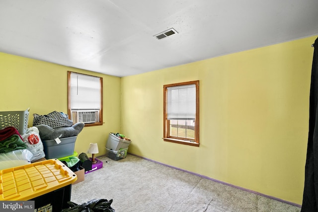 interior space with carpet and cooling unit