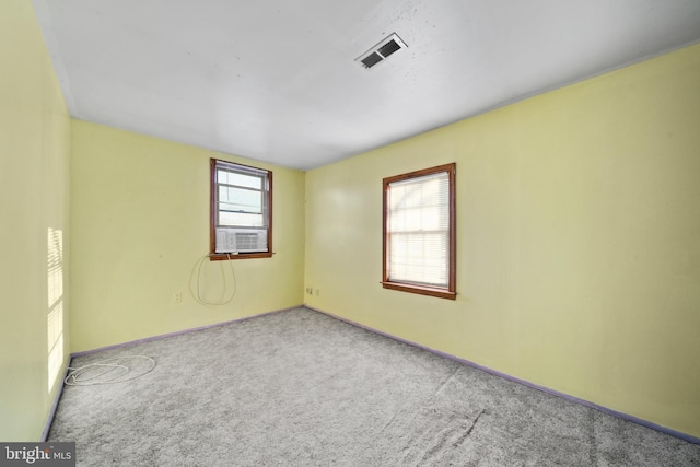 unfurnished room featuring light colored carpet