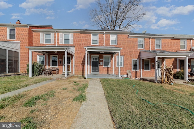 view of property featuring a front lawn