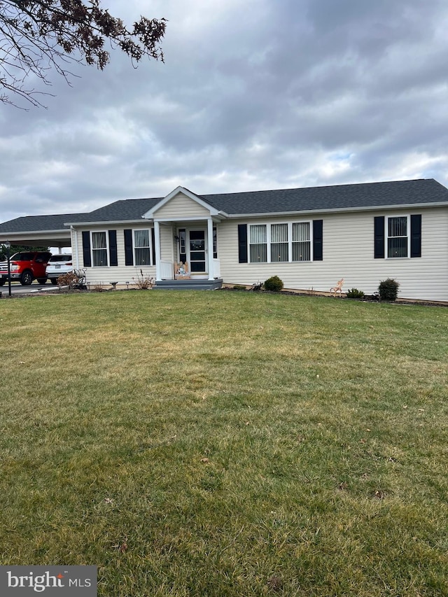 single story home with a carport and a front yard