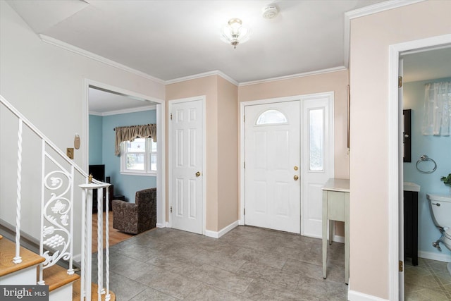 entryway featuring ornamental molding