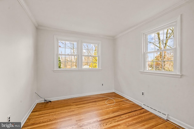 unfurnished room with crown molding and light hardwood / wood-style flooring