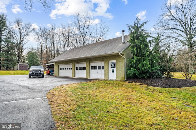 garage with a yard