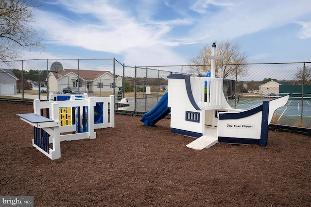 view of play area featuring tennis court