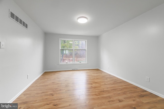 unfurnished room featuring light hardwood / wood-style floors