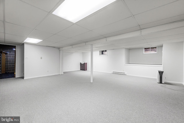 basement featuring carpet floors and a baseboard radiator