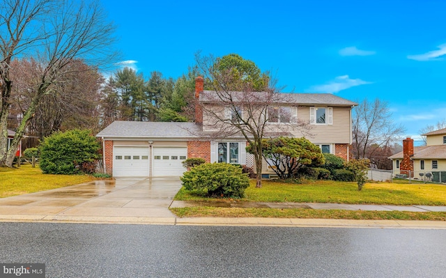 view of front of home featuring a front lawn and a garage