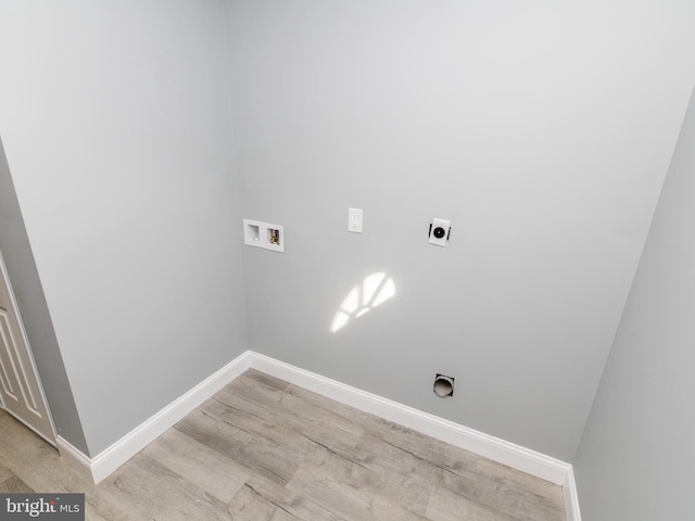 laundry room with laundry area, light wood finished floors, baseboards, hookup for a washing machine, and electric dryer hookup