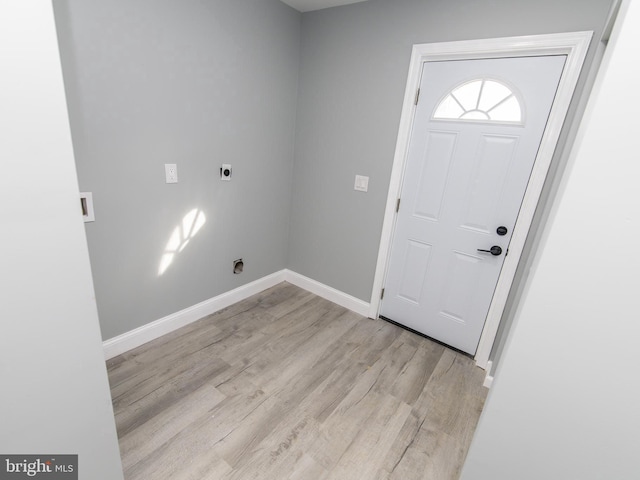 entryway featuring light wood-style floors and baseboards