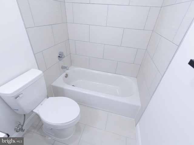 bathroom featuring toilet and tile patterned floors