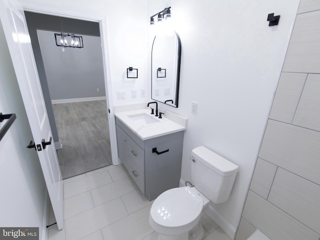 bathroom featuring vanity, toilet, and tile patterned floors