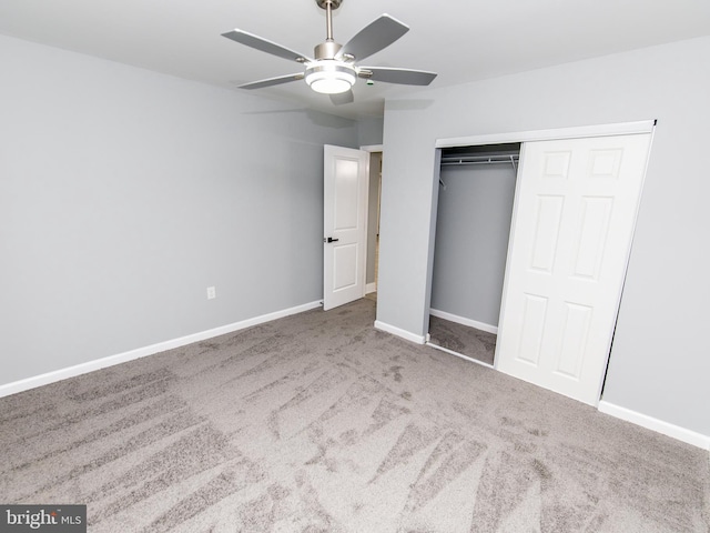 unfurnished bedroom featuring a closet, carpet flooring, ceiling fan, and baseboards