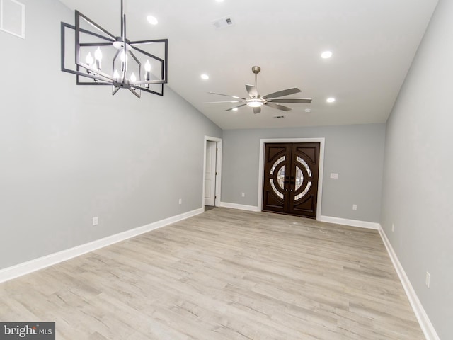 empty room featuring light wood-type flooring, visible vents, and baseboards