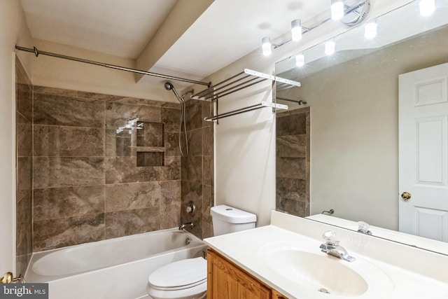 full bathroom with tiled shower / bath combo, toilet, and vanity