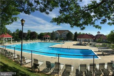 view of swimming pool with a gazebo and a patio area