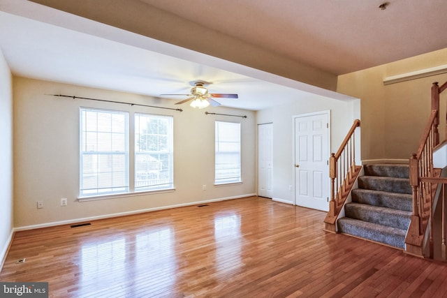 interior space featuring ceiling fan and wood-type flooring