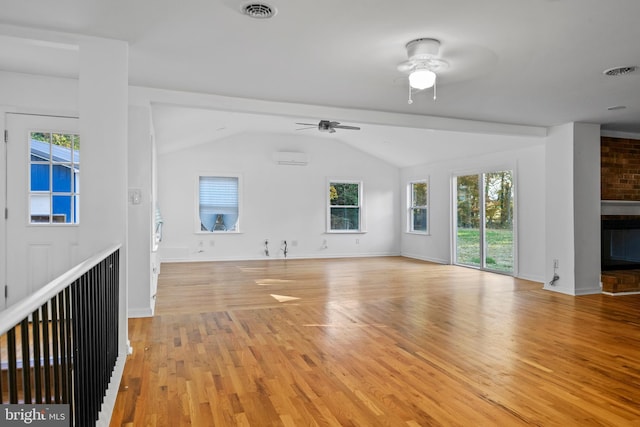 unfurnished living room with light hardwood / wood-style floors, plenty of natural light, ceiling fan, and lofted ceiling