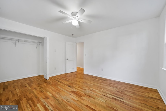 unfurnished bedroom featuring a closet, ceiling fan, and light hardwood / wood-style flooring