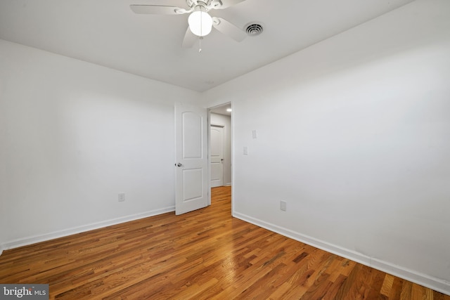 unfurnished room with wood-type flooring and ceiling fan