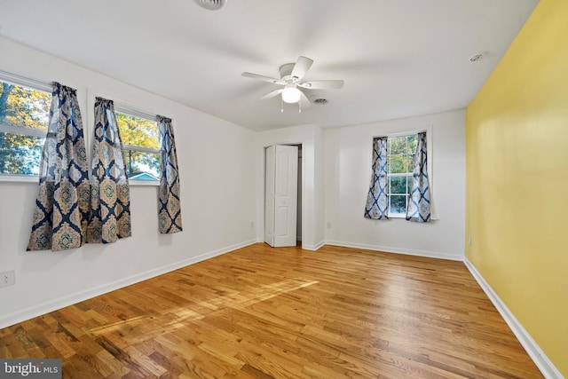 unfurnished room featuring ceiling fan and wood-type flooring