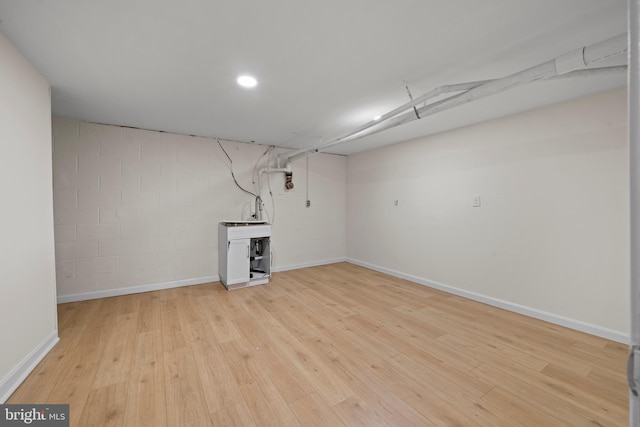 basement featuring light wood-type flooring