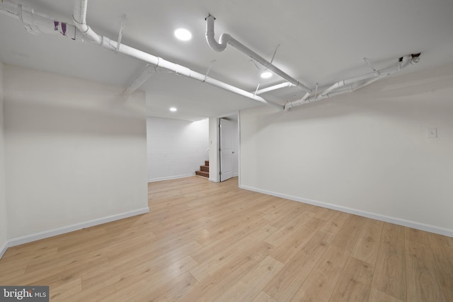 basement featuring light hardwood / wood-style flooring