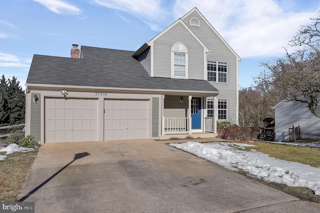 front of property featuring a garage and covered porch