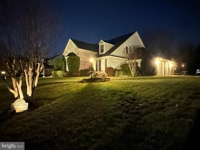 view of front of property with a yard