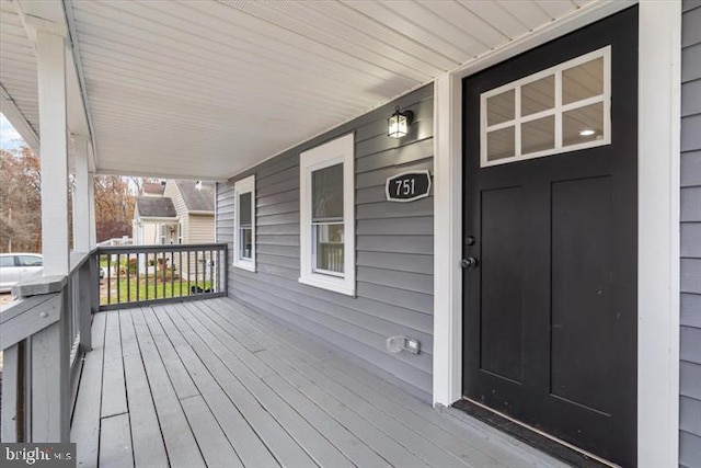 wooden terrace with a porch