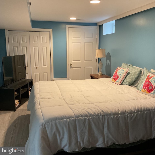 bedroom with hardwood / wood-style flooring