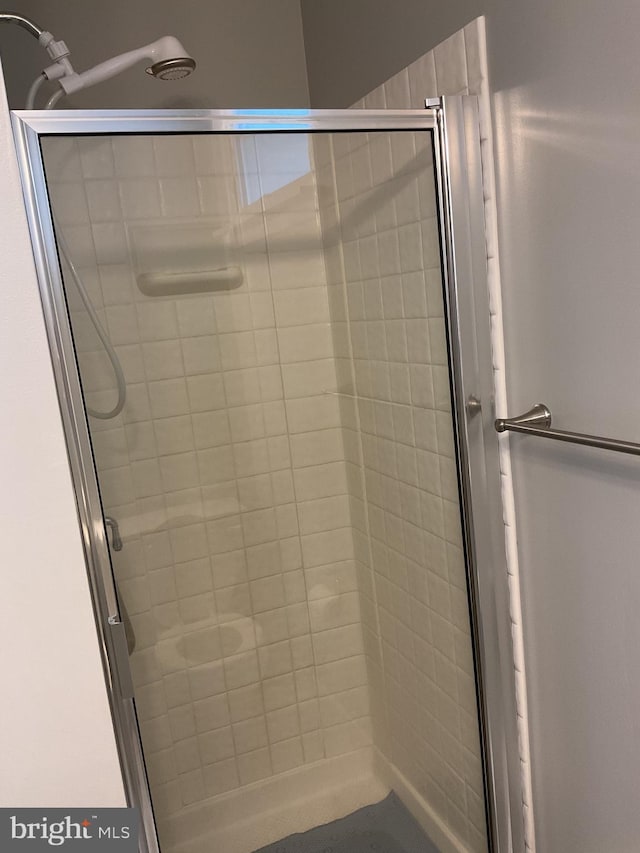 bathroom featuring an enclosed shower