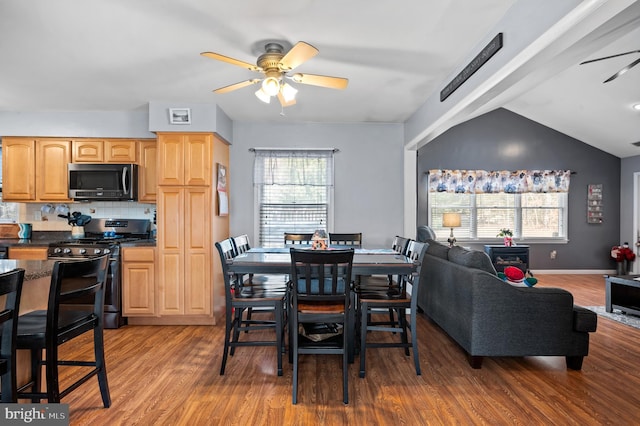 dining area featuring wood-type flooring, plenty of natural light, and ceiling fan