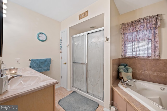 bathroom with tile patterned flooring, vanity, and independent shower and bath