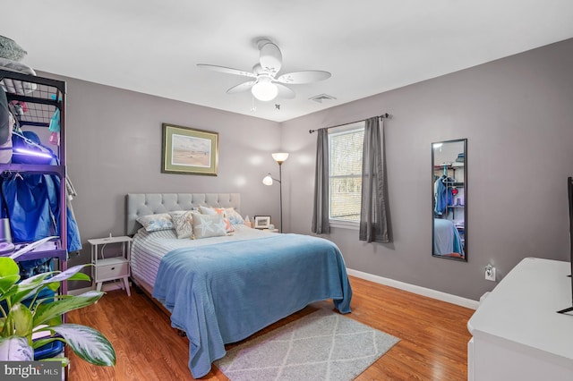 bedroom featuring hardwood / wood-style floors and ceiling fan