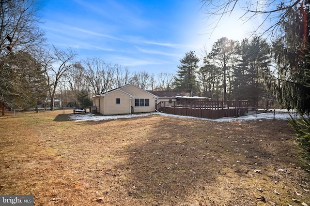 view of side of home featuring a wooden deck