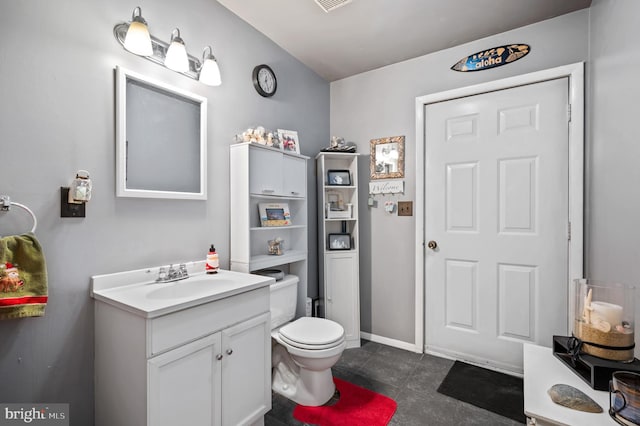 bathroom with vanity and toilet