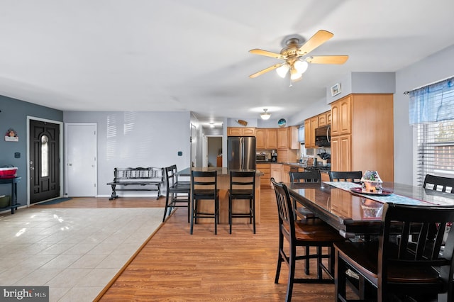 dining room featuring ceiling fan and light hardwood / wood-style flooring