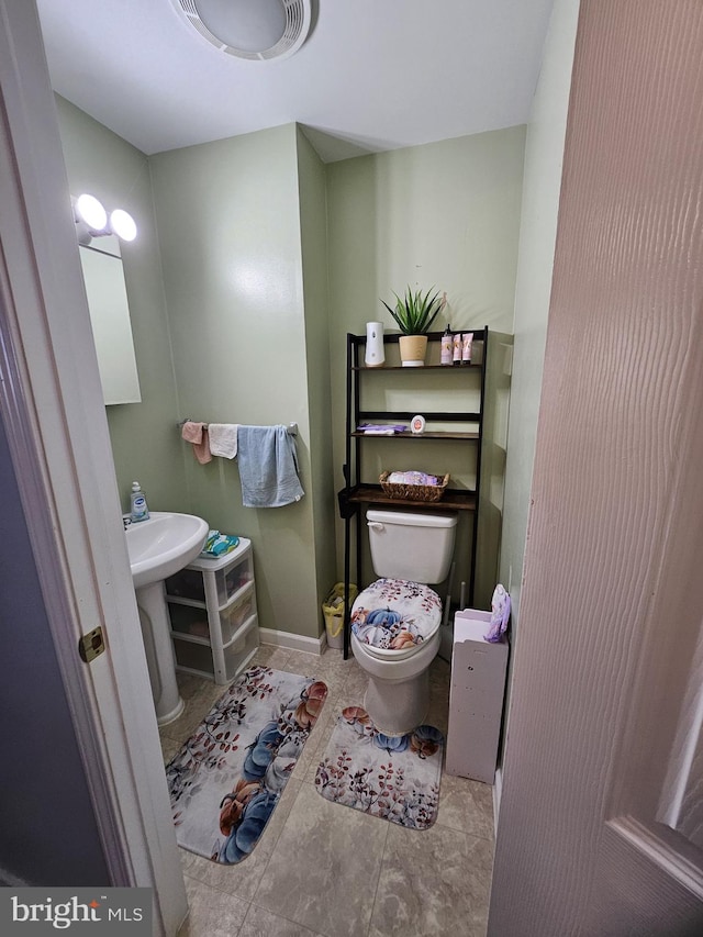 bathroom with toilet and sink