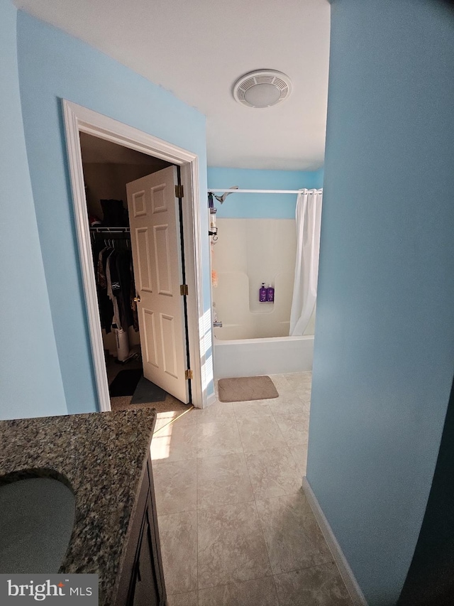 bathroom featuring vanity and shower / tub combo