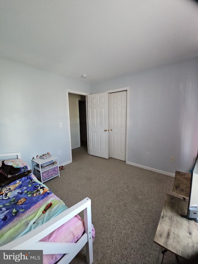 carpeted bedroom featuring a closet