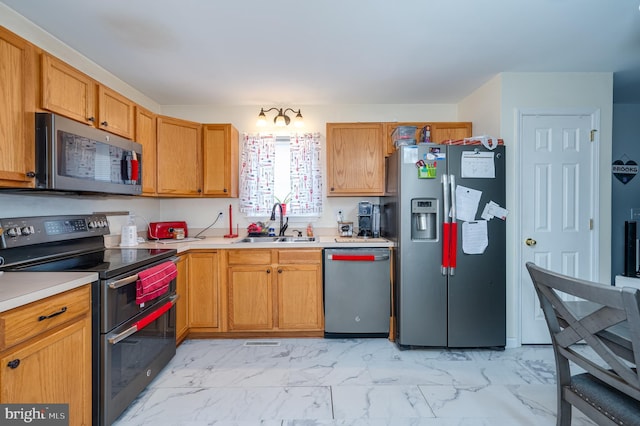 kitchen with appliances with stainless steel finishes and sink