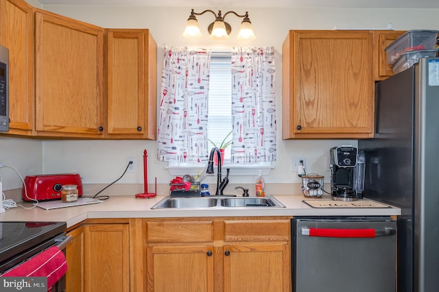 kitchen with stainless steel fridge, sink, and dishwashing machine