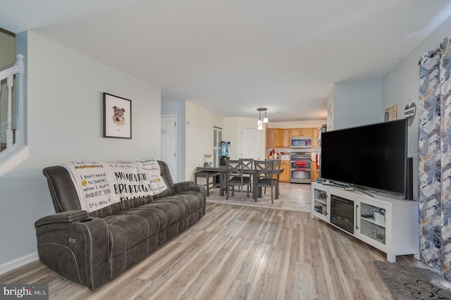 living room with light hardwood / wood-style floors