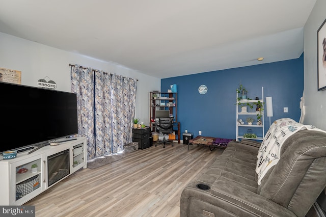 living room with light hardwood / wood-style flooring